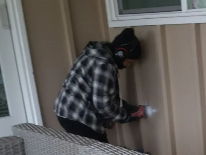 Professional electrician installing an exterior outlet in Greenland