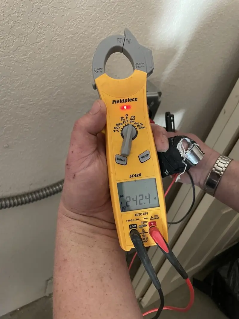 Voltage testing with clamp meter during Whole House Surge Protector in Greenland